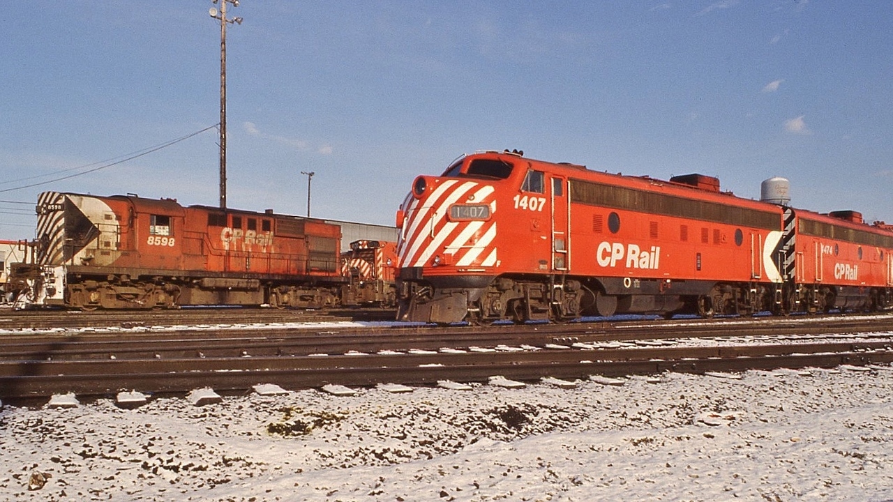 VIA Canadian F power: ex CP Rail FP9A 1407 and F9B 4474 at Agincourt for servicing by CP Rail on behalf of the  VIA Rail, 


    Also: MLW RS10s CP Rail 8598, a bunch of SW1200RS's, MLW M636 4721 is coupled to the B end of 4474.


    First generation power abounds at Agincourt, December 9, 1978 Kodachrome by S.Danko.


    Noteworthy: within weeks 4474 renumbered to 1961 retired 1983, 1407 retired by 1983.


    And that CPR script water tower....