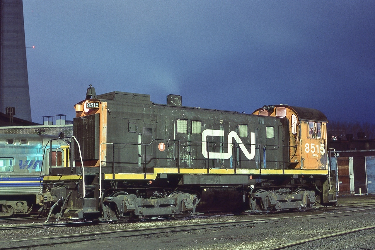 A ' Workhorse ' of the Spadina coach and freight house yards .....in the 'shadow' of the CN Tower – completed 1976,
   

   MLW 1959 built S-13 CN #8515 and an ex CN Budd Car 
  

   At CN Spadina, December 15, 1984 Kodachrome by S.Danko  


   Most of the S-13 retired by 1990, about eleven rebuilt renumbered to the 8700 series and by 1997 sold to various short lines.