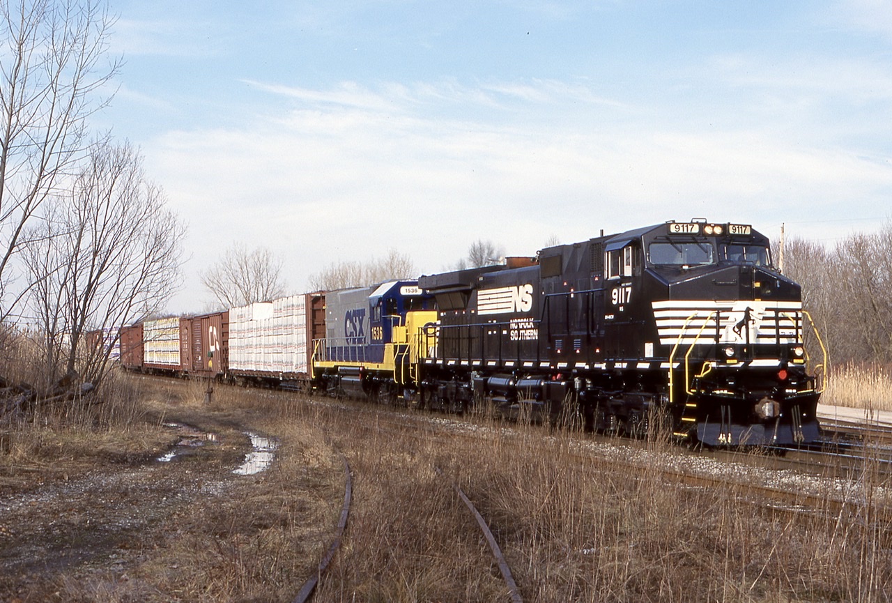 CN / NS 445 was always a nice catch back in the day especially considering the distance it has to travel between Fort Erie and Niagara Falls. CN back then and still today has no direct access to NS in Buffalo NY, so with that said NS still has to interchange with CN in Ontario, although they barely cross the border into Canada other the a mile into Fort Erie. This day the power was interesting as it was two freshly painted units. A NS Dash-9 and a CSX former Conrail GP15. It was odd seeing the CSX unit with the NS, and I wondered how this consist came to be.