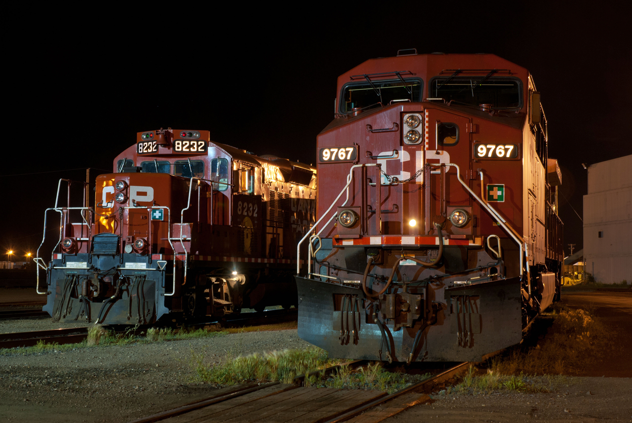 The time is 00:23 and things are pretty quiet around the shop tracks at Sutherland as two distant generations of locomotives rub shoulders. 2003 built AC440CW 9767 and 1989 rebuilt GP9u 8232 await their next call to action.  The 8232 was assigned to the TEC train at the time and was touring much of the west.