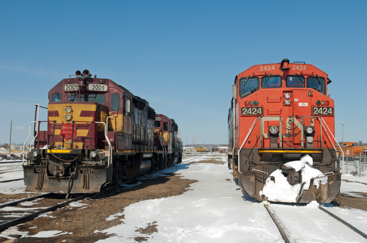 Yard power at left and road power at right await the next call to action at the north end of CN's Fort St John Yard.