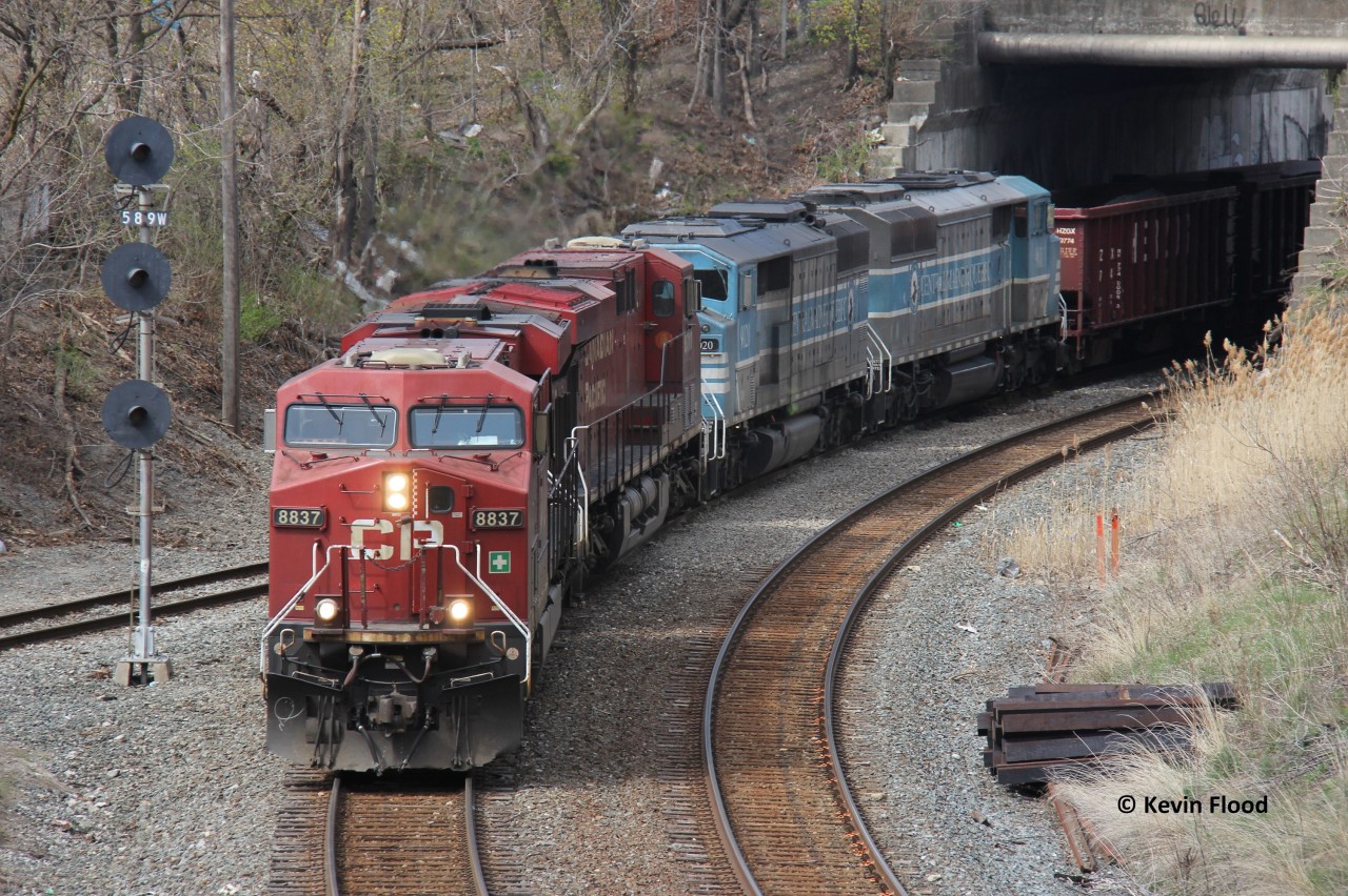 After not being able to shoot the ballast train down the Hamilton Sub with the two CMQ units (9020-9011) on April 13 (it was well-documented at least), I thought I would have my chance when the train returned to the area after re-filling in Sudbury. This was the day for that return trip; however, since CP has a tendency to be unpredictable with their operations, the train was combined with 246 at Lambton and there was no ballast dumping. Of course, to add insult to injury, two plain-jane GEs were the leading power. Nonetheless, I documented it, and heck, barely anyone was out for it! The following day would find the ballast train with the sole CMQ power dumping northbound under gloomy skies.