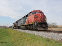 CN 502 is pictured trundling along the Hagersville Sub at station sign Onondaga on a lovely spring afternoon. Power was CN 2443 and CN 3234 - a combination reflecting new and old CN paint schemes. Supposedly, 2443 suffered from a fire shortly after the date of this photo.