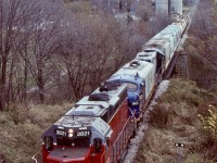 For a period of time GEXR train 581 was very predictable for motive power, with GP38 3821, the two FP9’s 1400 & 1401 and GP9 4001. Typically the “F” units were considered as “B” units and rarely led trains unless there was no other leader available. Unfortunately as their age took its toll the two “F” units eventually were sidelined for good. Thankfully OSR would save them from becoming scrap. Nevertheless train 581 was always a good catch and chase. This day as the weather deteriorated I chased train 581 westward from Stratford, unfortunately one of the “F” units was out of service but the train was still a nice sight rumbling over the creek in Mitchell and ducking under one of the few road bridges along the line. 