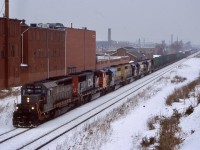 The darkest days always bring on the best power. Norfolk Southern spent a good part of the 2000’s hungry for motive power. It would appear that Ontario Northland was not in the same boat. After spending some time leased to NS these four ONR SD40’s are heading back to home rails. Leased GCFX 6060 (ex CN) leads train 338 on this dreary day as they pass through Hamilton. 