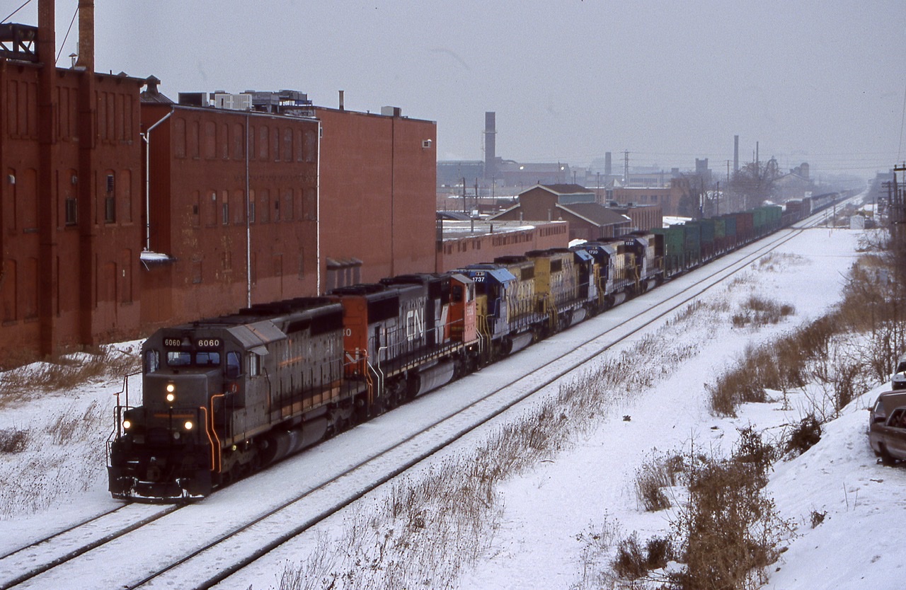 The darkest days always bring on the best power. Norfolk Southern spent a good part of the 2000’s hungry for motive power. It would appear that Ontario Northland was not in the same boat. After spending some time leased to NS these four ONR SD40’s are heading back to home rails. Leased GCFX 6060 (ex CN) leads train 338 on this dreary day as they pass through Hamilton.