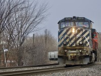 CN M323 rounds the curve in the burrow of Pointe-Saint-Charles in Montreal, Qc with a different looking dash 9, BCOL 4646 in the lead!