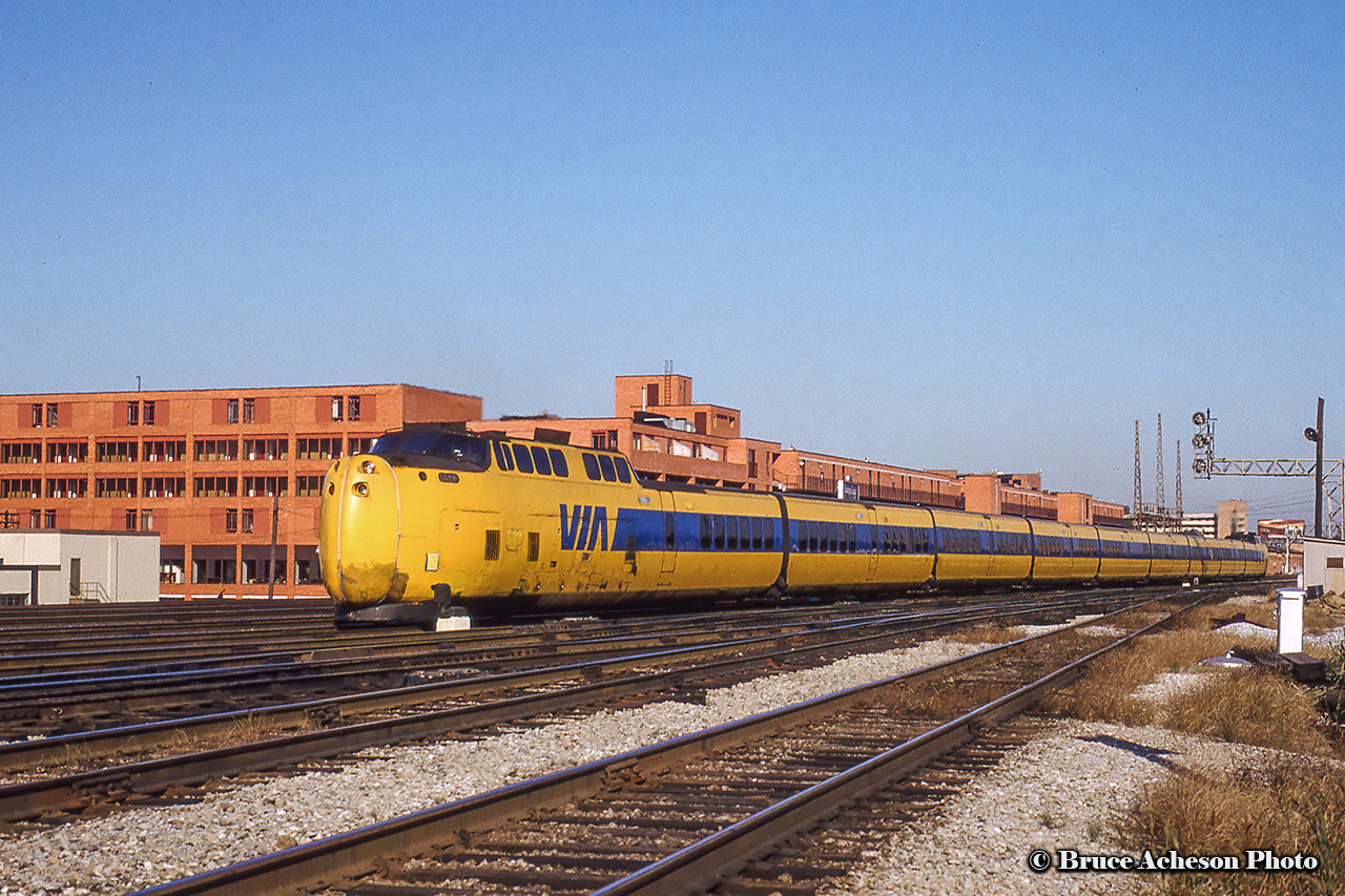 Turbo equipped 66 departs Toronto, passing over Jarvis Street bound for Montreal with VIA 154 bringing up the rear.  Note the two near tracks are to old high line freight bypass.