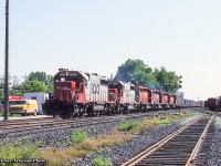 A shot probably taken at one of our LLL, Leaside Loco League, meet ups of eastbound SD's through Leaside with a pair of SOOs up front. Lots of CAST containers bringing up the head end.