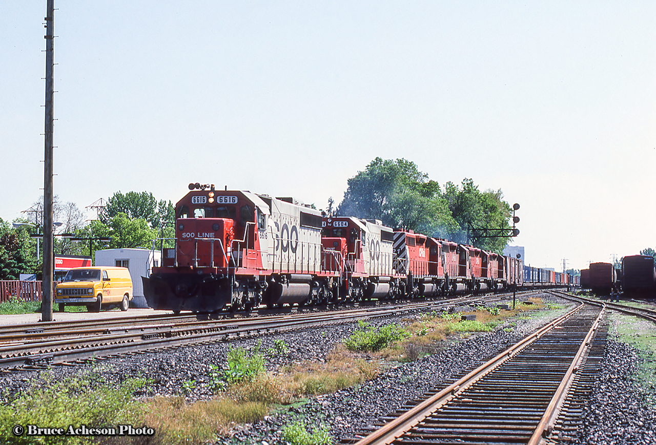 A shot probably taken at one of our LLL, Leaside Loco League, meet ups of eastbound SD's through Leaside with a pair of SOOs up front. Lots of CAST containers bringing up the head end.