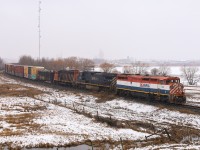 CN A 41851 18 trundles down the old NAR mainline from Peace River to Edmonton during a spring snow storm.  Todays consist features BCOL 4609, BCOL 4649 and CN 9527