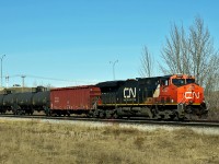 ES44DC CN 2337 makes its way south on the Camrose sub taking an oil train to the Kinder Morgan/Pembina loading facility.