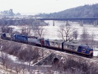 This is probably the most interesting and colourful consist I ever photographed on GEXR train 581. After lifting GP 9 4001 from the shop, the train  now has just finished backing a cut of salt hoppers to the load out at the harbour. Power this day is a pair of ex VIA FP9’s, a former DRG&W GP35, now a CEFX GP38, a LLPX GP38, formerly an IC GP40 and  a former SP GP9. The salt company can be seen well In the distance, as well as CP’ s abandoned  Goderich subdivision  crossing the river in the foreground. 


