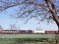 The buds are just beginning to form on the trees as cowl 5519 and a NS unit head westward through Stewartown on a nice spring day.