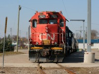 CN L542 power is viewed awaiting its next call to duty along Eagle Street on the Fergus Spur in Cambridge. The power includes former hump unit GP38-2 7521 and GMTX 2695 with tankers lifted from FloChem in Guelph. 