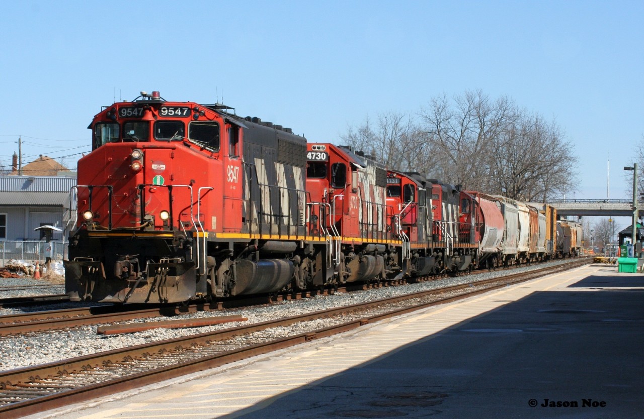 CN L568 is viewed departing Kitchener on the Guelph Subdivision with 9547, 4730, 4131 and 4130 as it heads westbound to Stratford with a short train.