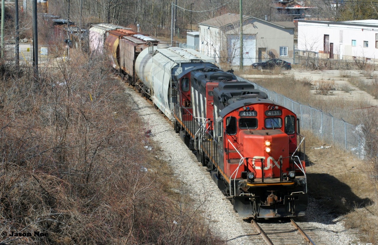 CN L568 with vintage GP9RM's 4131 and 4130 are viewed shoving back to the Guelph Subdivision in Kitchener, Ontario on the Huron Park Spur returning from the interchange with Canadian Pacific at South Junction from the Stirling Avenue bridge.