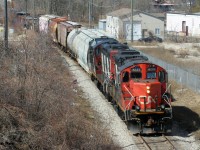 CN L568 with vintage GP9RM's 4131 and 4130 are viewed shoving back to the Guelph Subdivision in Kitchener, Ontario on the Huron Park Spur returning from the interchange with Canadian Pacific at South Junction from the Stirling Avenue bridge. 


