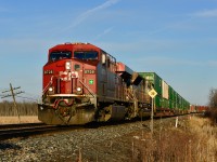 CP 133 throttles up as it departs Smiths Falls. Clear skies would blind the crew for part of the trip as they head west for Toronto. In trailing position is CP 7010, one of ten SD70ACu's sporting a heritage livery.