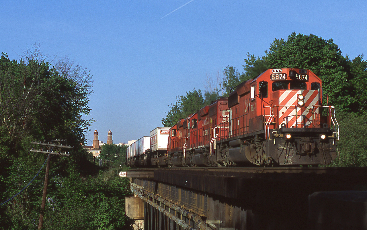 Westbound Expressway train #121 is crossing the Credit River on the east side of Streetsville Ontario with it's typical three-pac of SD40-2s.