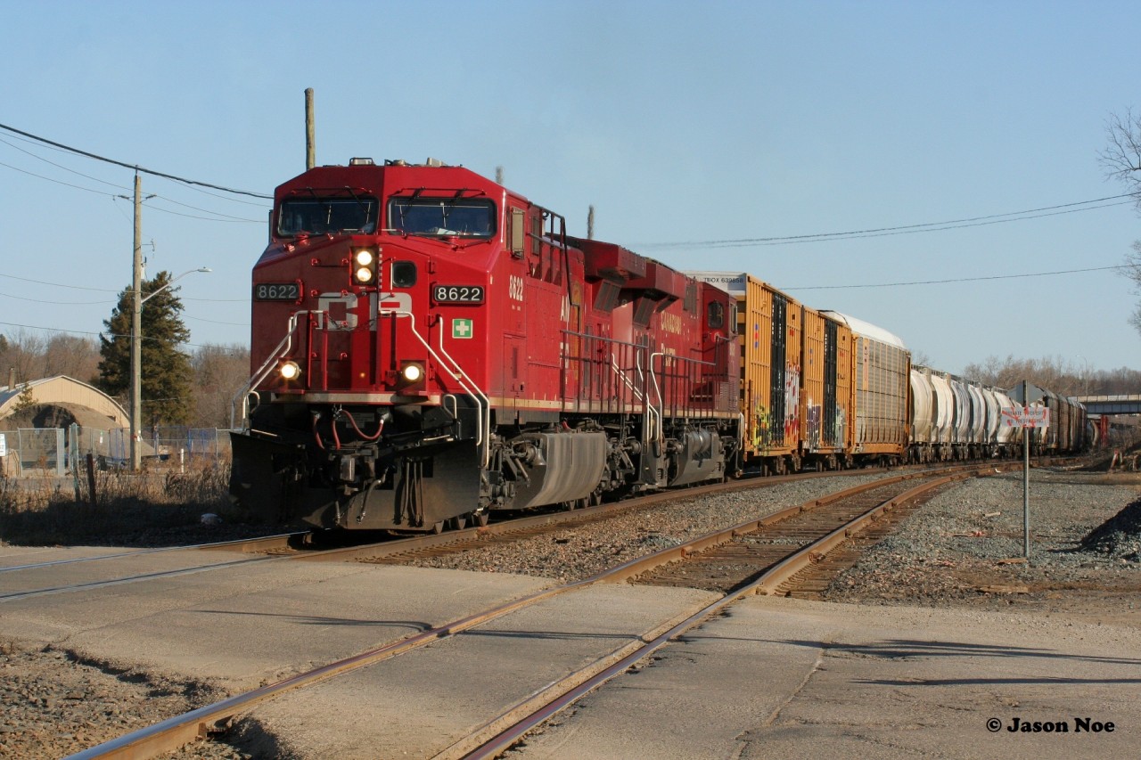 After lifting cars at Coakley (W-Coak), CP 8622 is viewed approaching the Oxford Street crossing in Woodstock as it leads 235 westbound to London.