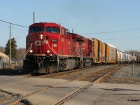 After lifting cars at Coakley (W-Coak), CP 8622 is viewed approaching the Oxford Street crossing in Woodstock as it leads 235 westbound to London. 