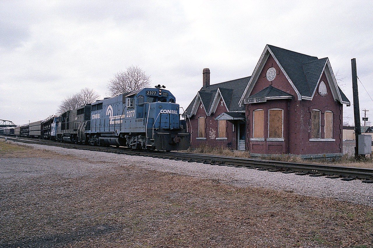 Later in the afternoon and CR 2377 with 2379 is heading back stateside after a traffic exchange with CN. The old B-1 station; its last use a train order office I believe, is about 6 months from being hoisted up and moved to the Ft. Erie Railroad Museum on Central Av, where it would keep CN 6218 company. The moving process began 40 years ago this month.