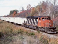 By this date the CN roadrailer trailers had been transferred to NS’ Triple Crown operation. It was a neat train to catch either way but unfortunately the age of the trailers finally caught up with them and they were pulled off the road a few years later. Here a line SD40 does the honours at mile 30 of the Halton subdivision.