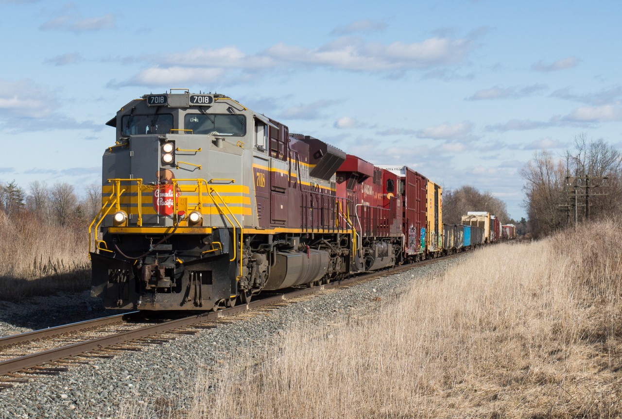 CP 237 heads towards Concession 6 in Waterdown behind CP 7018.  On a day that was mostly cloudy we lucked out with some late day sun.