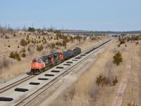 CN L562 led by CN ES44DC #2235 heads towards Trillium's Feeder Yard along the CP Hamilton Subdivision. This section is famous for its recognizable trench section which was dug out to go under the Welland Canal.