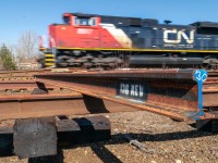 CN's classic rock intermodal train rattles the streets of Coniston as it races northward past some new rail. CN 8917 has one heck of a beastly K5LLA.