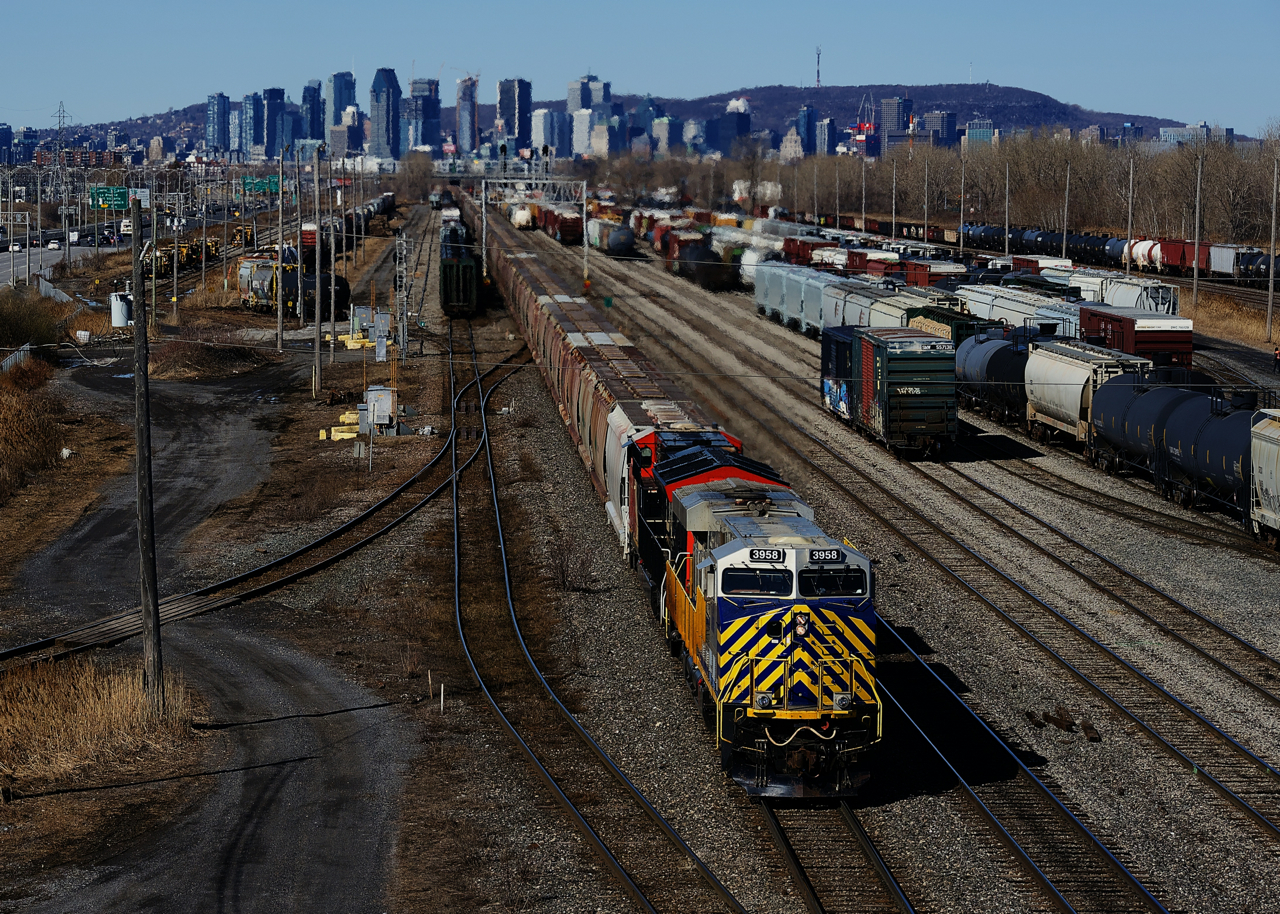 Loaded potash train CN B730 is passing a full Southwark Yard with CN 3958 & CN 3261 up front, CN 2961 mid-train and CN 3871 on the tail end.