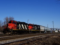 The Pointe St-Charles Switcher has just arrived at it namesake yard from the Port of Montreal and is shoving eight cars from there into the yard with CN 4140 & CN 7060 for power.