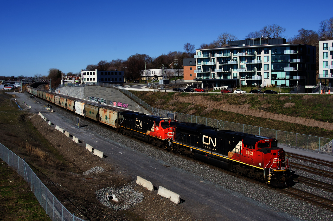 CN B730 has AC power 99% of the time and with CN only having four non-GE AC units, it's pretty rare to get an EMD leader on this potash train. But here for once ex-EMD demo CN 8103 leads the train as it crawls towards a crew change at Turcot Ouest.