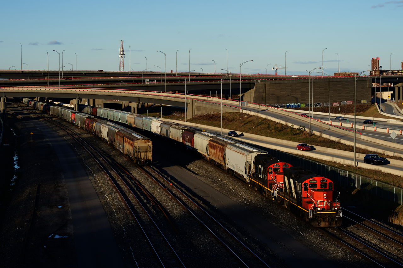 CN 596 has a pair of GP9s (CN 4140 & CN 7060) as it heads to Taschereau Yard with 80 cars.