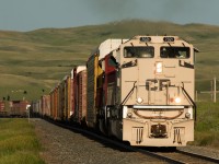 CP 7021 and 7051 are screaming along in the eighth notch as they drag train 499 upgrade toward Secretan Saskatchewan and into the setting sun on Canada Day. 