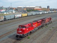CP 411's power is seen here backing towards the east end of Moose Jaw yard on it's way to the shop.  The clean 7006 was a nice change from the normal grungy GEs. 