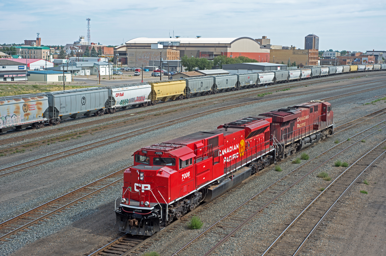 CP 411's power is seen here backing towards the east end of Moose Jaw yard on it's way to the shop.  The clean 7006 was a nice change from the normal grungy GEs.