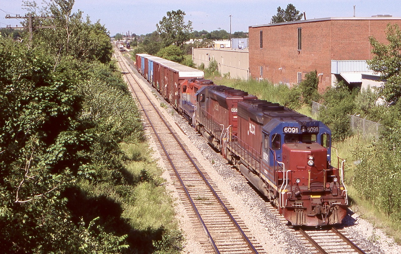 The Helm leasing units that came to fill in a motive power void were a nice change of pace even if they didn’t last all that long. The story I heard was the Woodward equipment on board was too complicated to maintain fit the small GEXR maintenance team. Here train 432 has a former  CN SD40 and ex DRG&W SD45 rebuilt into a SD40 up front with a RailAmerica GP35 as they get head room at Kitchener.