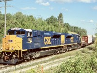 These were interesting times for Railfaning the GEXR. A number of newly built SD70ACE’s built in London, Ontario were briefly tested over the Goderich Exeter, between London and Stratford as well as some runs into Toronto. A number of CSX SD70ACE’s made the trip to Toronto as well as at least on CN SD70M-2. There probably was a number of others I may have missed, as I photographed a few UP units in Stratford as well. Here a pair of new CSX units lead GEXR train 531 east of Acton with a buffer car behind the power. The train has just begun to tackle the Niagara escarpment. From what I was told after the CSX units left Canada the headed to the Montana Railink for testing before finally making it to CSX. Unfortunately they never seemed to be a good fit for CSX and have since been returned to Progress Rail and some sold to other railroads.