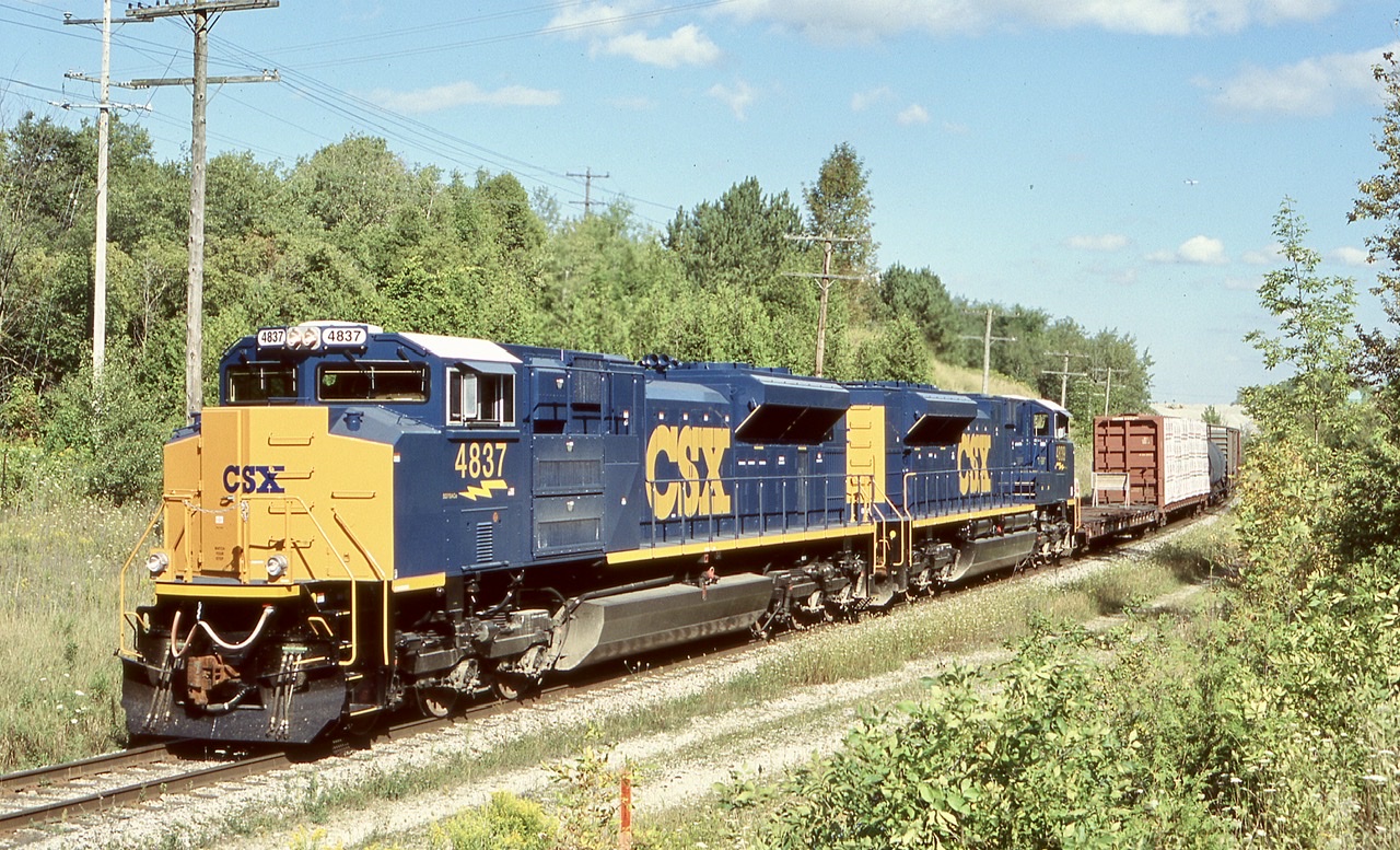These were interesting times for Railfaning the GEXR. A number of newly built SD70ACE’s built in London, Ontario were briefly tested over the Goderich Exeter, between London and Stratford as well as some runs into Toronto. A number of CSX SD70ACE’s made the trip to Toronto as well as at least on CN SD70M-2. There probably was a number of others I may have missed, as I photographed a few UP units in Stratford as well. Here a pair of new CSX units lead GEXR train 531 east of Acton with a buffer car behind the power. The train has just begun to tackle the Niagara escarpment. From what I was told after the CSX units left Canada the headed to the Montana Railink for testing before finally making it to CSX. Unfortunately they never seemed to be a good fit for CSX and have since been returned to Progress Rail and some sold to other railroads.