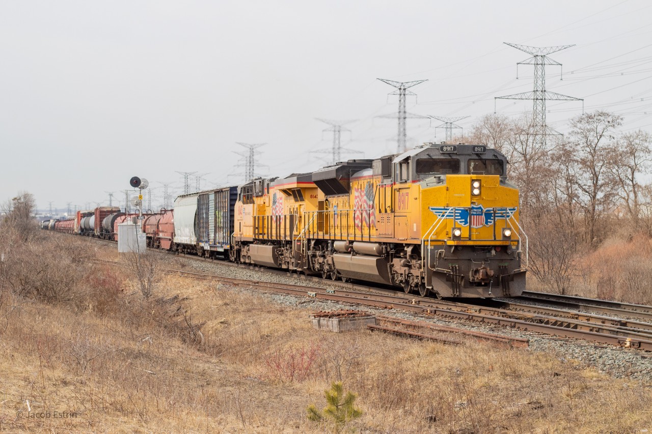 UP 8917 & 8143 are in the lead of CN M394 as it slowly climbs the grade at mile 2.5 of the Halton Sub.