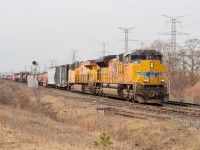 UP 8917 & 8143 are in the lead of CN M394 as it slowly climbs the grade at mile 2.5 of the Halton Sub.