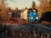 The sun rises on the final day...
GMTX 333 has finished lifting the final 4 hoppers from industries in Orangeville and is seen making its way south towards the yard before they begin the trip southbound to Streetsville.

As of April 1st 2022, the tracks in this photo have been completely ripped up as the city of Orangeville wants a functional trail by summer 2022. I wish it was an April Fools joke. :(