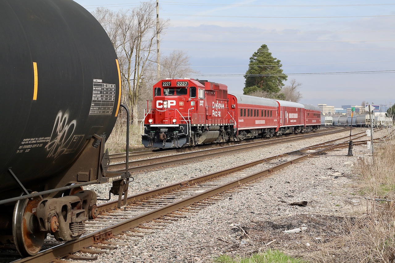 CP's new TEC train heads eastbound through Streetsville after spending the last few days along the Windsor and Hamilton subdivisions. The train is seen passing 3 tank cars left along the main by H24 earlier, that will later make their way to Hornby yard.