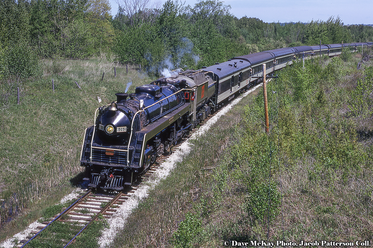 Almost to the end of the line, CNR 6060 leads an excursion from Toronto up to Midland at Victoria Harbour, rounding the curve beneath Park Street.More Midland Sub:July 1958 by Bill ThomsonAugust 1976 by Arnold MooneyMarch 1989 by Barry SchroederDave McKay Photo, Jacob Patterson Collection Slide.