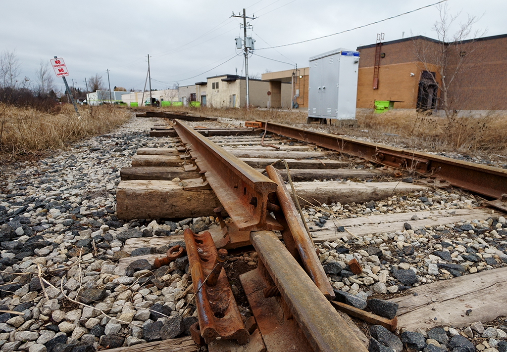 Abandoned and pulled up, engineering crews are in the middle of tearing up the old mainline to Owen Sound on what used to be Mile 35.37 of the former CPR Owen Sound Subdivision. The northern part of the line from Orangeville to Owen Sound didn't last as long as the southern part did with what little customers (and abandonment of the branches like the Teeswater, Walkerton Subs between Orangeville and Owen Sound) were left along the line and constant drift busting in the winter time with the plows, the north end succumbed to abandonment in late 1995 but the south end from Orangeville to Mile 2.4 at Streetsville still prospered till late 2021. So here we are in the year 2022 with rising oil prices and businesses trying to find alternative transportation methods to ship products by rail, the short sightedness along with the anti-rail mentality of the mayor and council will rear it's ugly head to the Town of Orangeville in the distant future.