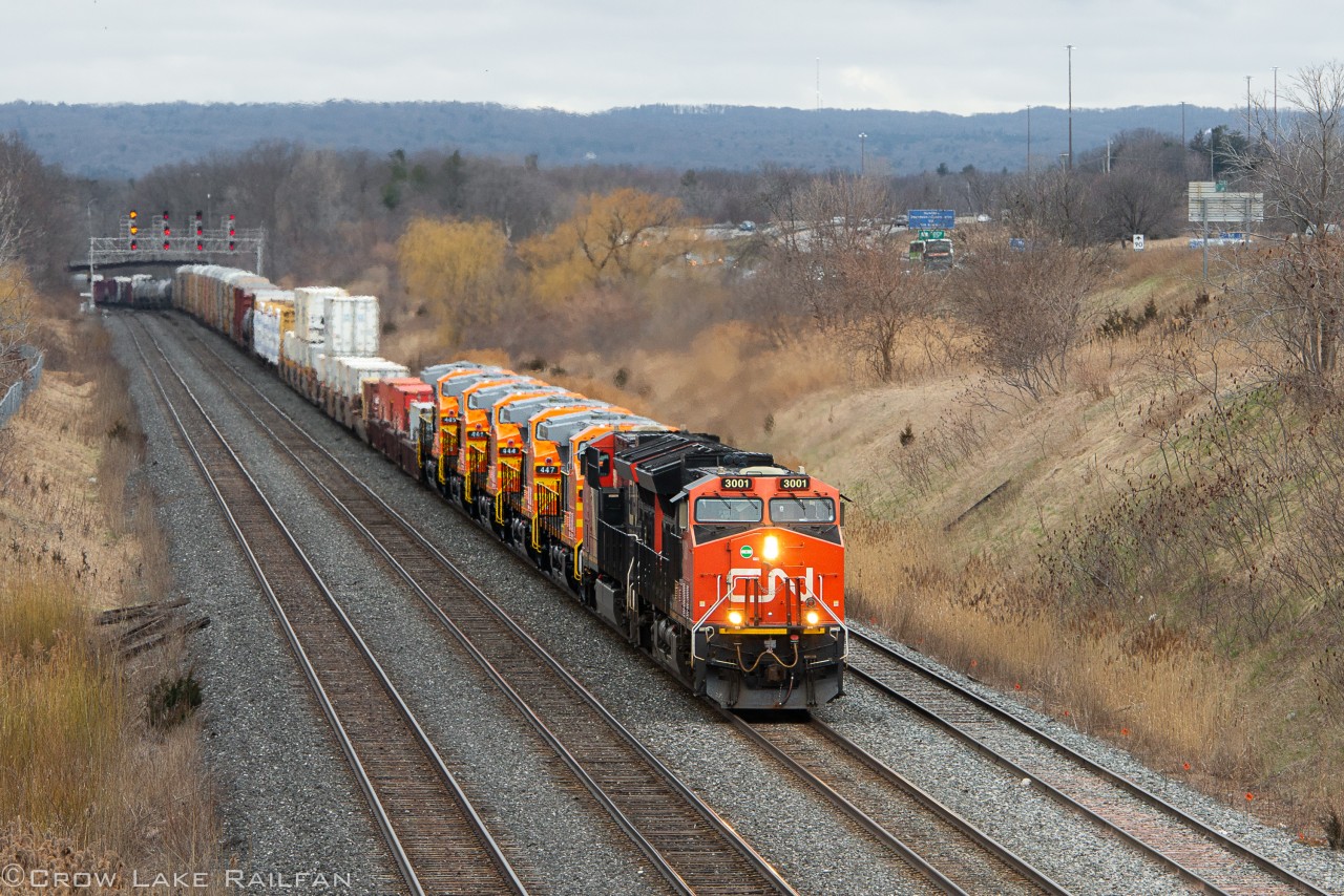 CN A422 crawls into the Aldershot GO Station & yard with the last 5 new Quebec North Shore & Labrador units in tow.