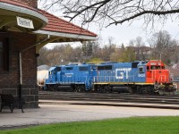 1973-built Grand Trunk Western GP40-2 6420 sits in front of the 1905-built Grand Trunk Railway station in Brantford. Following their lunch break, the conductor and brakeman were walking to the train as I took this photo, and 580 would soon depart for Cainsville to switch Blastech and Rembos.  Today was this first day these two units were assigned to 580 and they have already attracted a fair bit of foamer attention.  Hopefully the pair stick around for a while.  