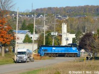 With the Orangeville highlands in the background, the GIO crew is busy serving customers in the north end of Orangeville in the industrial park with only a few weeks to go before all service ends. By all accounts the track in Orangeville is now all ripped up. Even Open Street Map on this site shows it all as a trail... already. 

